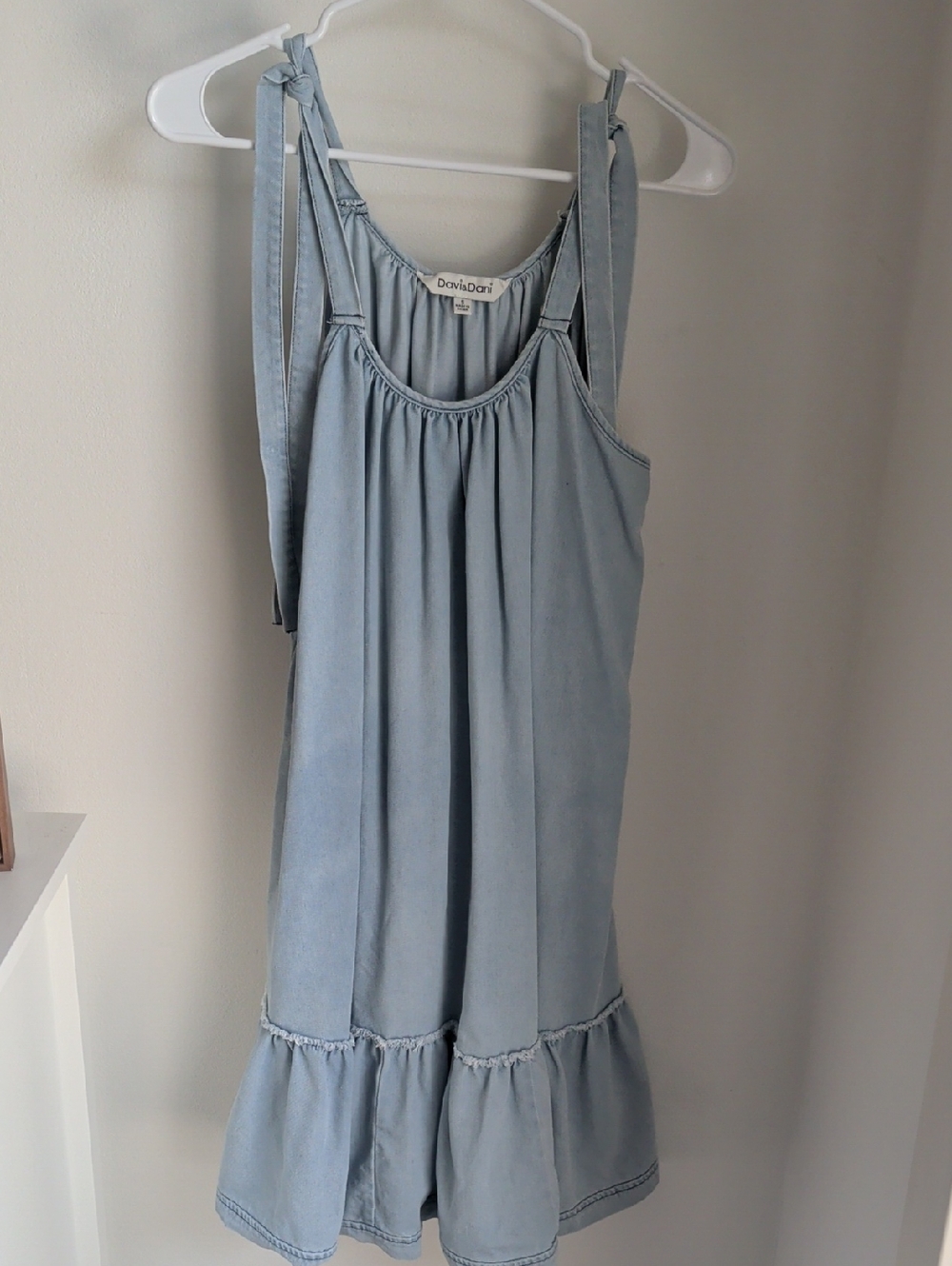 Davi & Dani light wash denim mini dress  tie shoulder straps and ruffle Hem